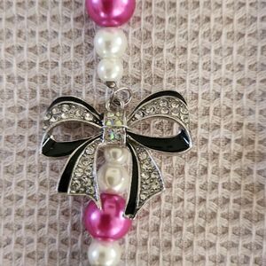Hot pink and black beaded necklace with rhinestone bow